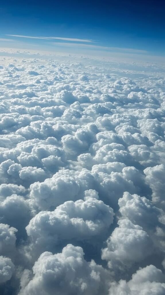 Vertical dense cotton-soft clouds stretching far