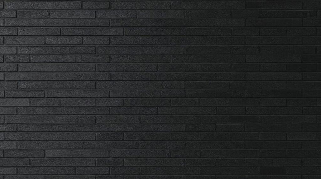 Textured Matte Black Brick Wall Background
